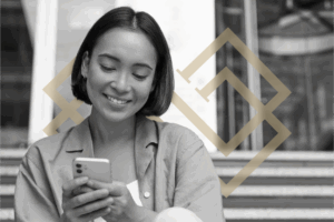 A woman smiles as she learns about salmon DNA facial in New York City.