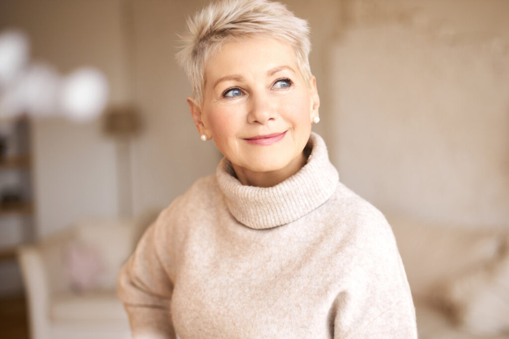 Smiling woman in a sweater.
