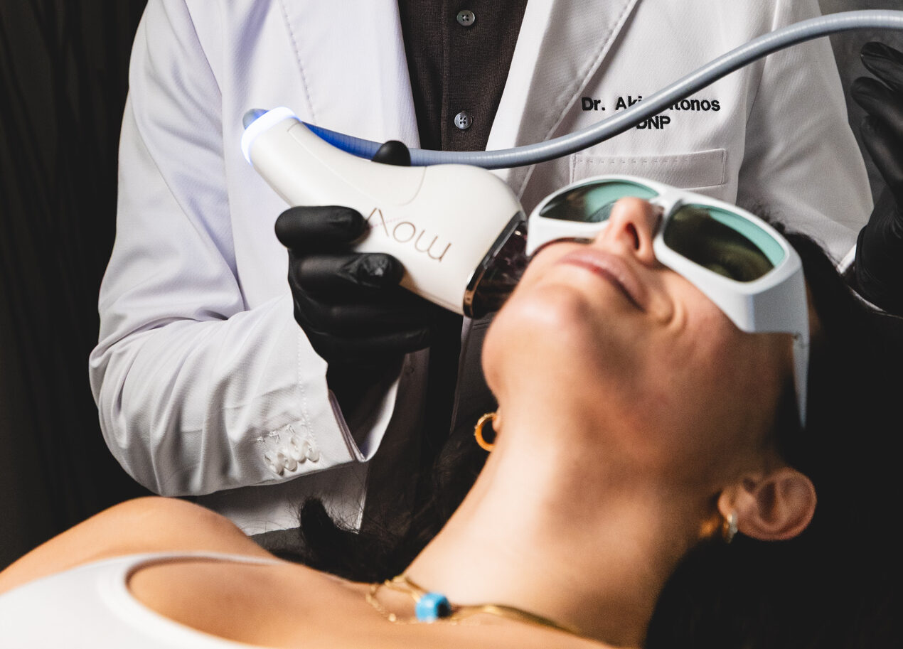 A woman reclines as she receives hyperpigmentation treatment in Upper East Side, NYC